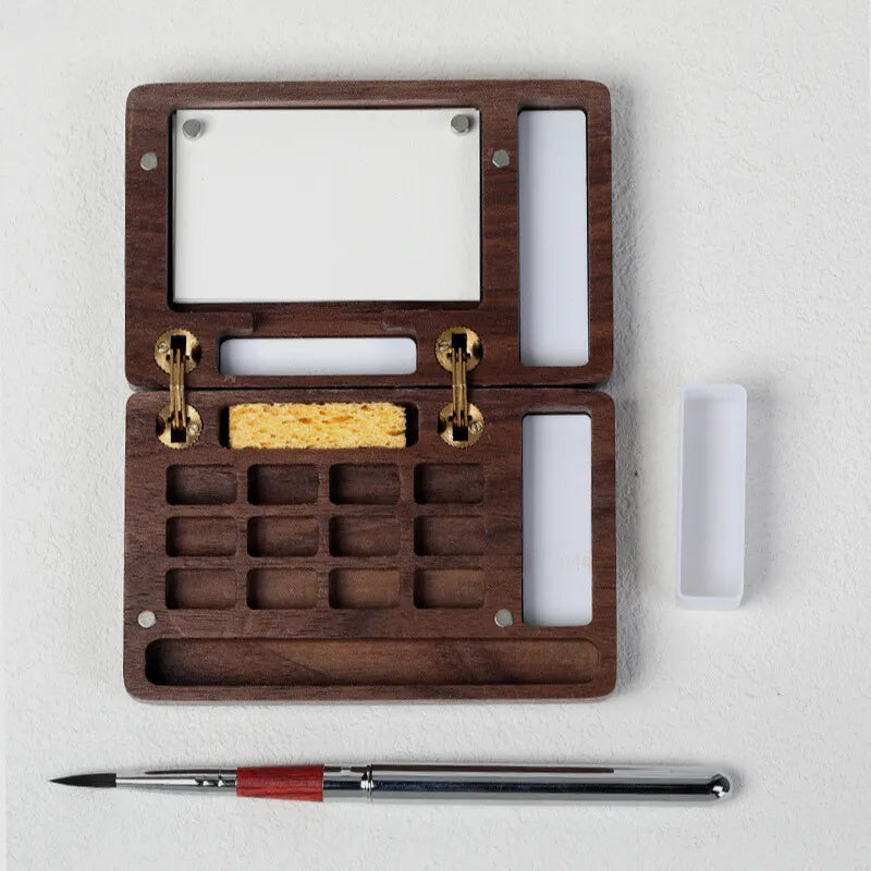 Caixa de paleta de aquarela portátil
Paleta magnética de madeira
Ferramentas de pintura ao ar livre
Paleta de aquarela para viagem
Conjunto de pintura de aquarela compacta
Caixa de aquarela de madeira para artistas Caixa de Paleta de Aquarela Magnética em madeira de nogueira, com espaço para 12 cores, mini lápis de viagem, esponja e folhas de papel aquarela Baohong 300g. Compacta e magnética, é ideal para artistas que pintam ao ar livre. Perfeita para transportar e usar em qualquer lugar.