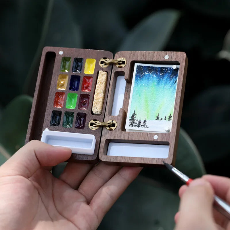 Caixa de paleta de aquarela portátil
Paleta magnética de madeira
Ferramentas de pintura ao ar livre
Paleta de aquarela para viagem
Conjunto de pintura de aquarela compacta
Caixa de aquarela de madeira para artistas Caixa de Paleta de Aquarela Magnética em madeira de nogueira, com espaço para 12 cores, mini lápis de viagem, esponja e folhas de papel aquarela Baohong 300g. Compacta e magnética, é ideal para artistas que pintam ao ar livre. Perfeita para transportar e usar em qualquer lugar.