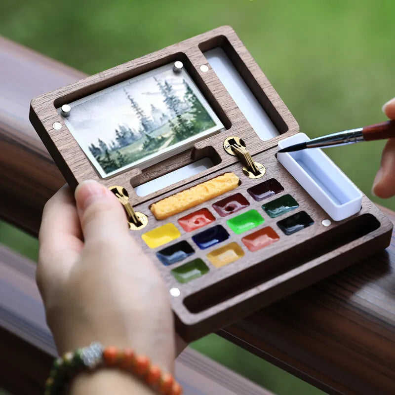 Caixa de paleta de aquarela portátil
Paleta magnética de madeira
Ferramentas de pintura ao ar livre
Paleta de aquarela para viagem
Conjunto de pintura de aquarela compacta
Caixa de aquarela de madeira para artistas Caixa de Paleta de Aquarela Magnética em madeira de nogueira, com espaço para 12 cores, mini lápis de viagem, esponja e folhas de papel aquarela Baohong 300g. Compacta e magnética, é ideal para artistas que pintam ao ar livre. Perfeita para transportar e usar em qualquer lugar.
